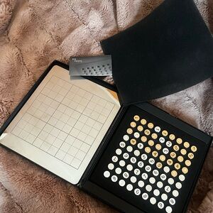 Sudoku metal 9x9 Saks 5th Avenue 
Stainless steel set with answer booklet